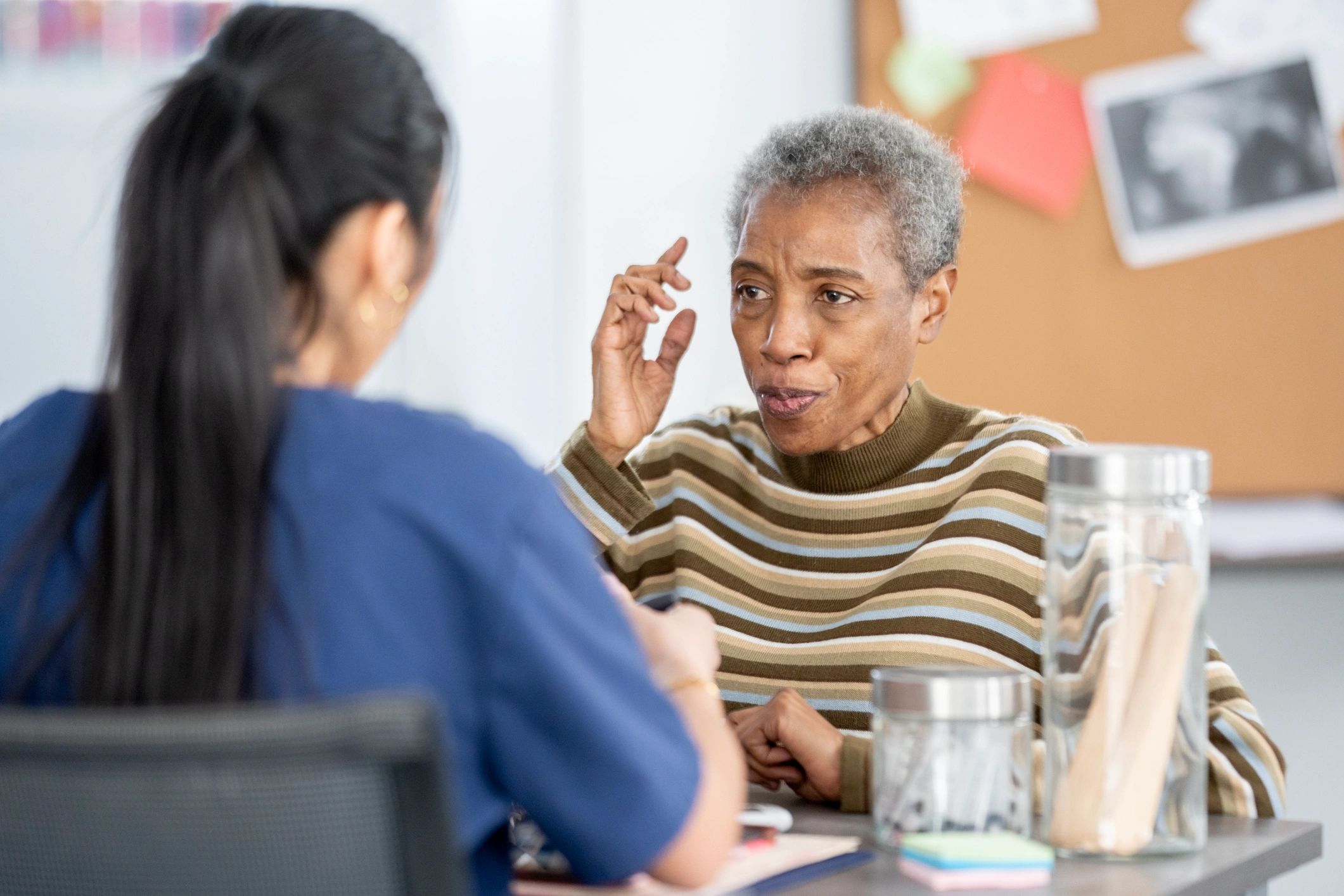 Patient speaking with a caring clinician during consultation
