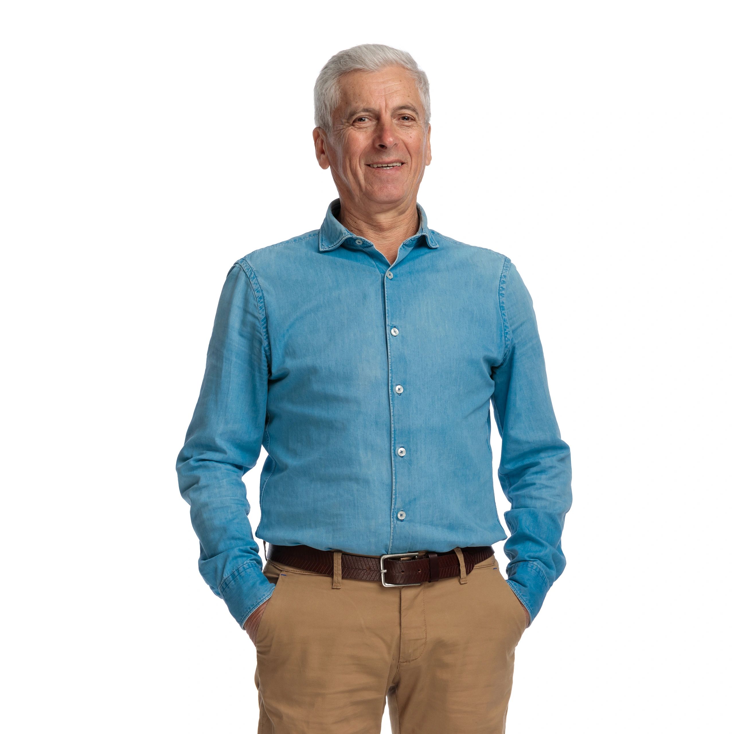 Older man smiling confidently in studio portrait