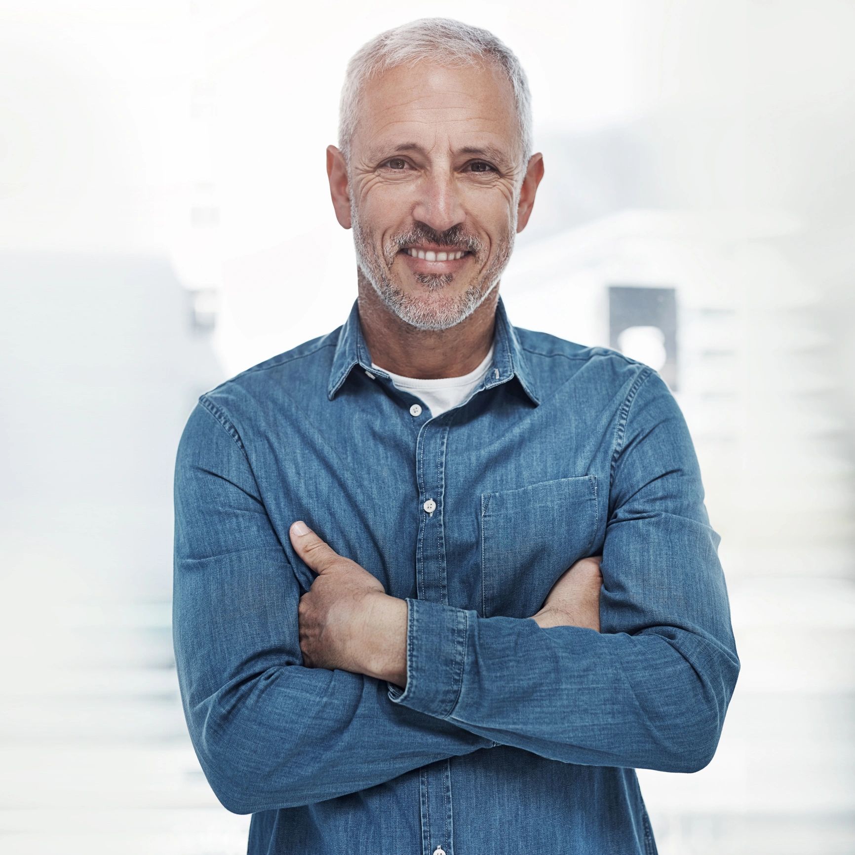 Confident mature man smiling in a professional setting