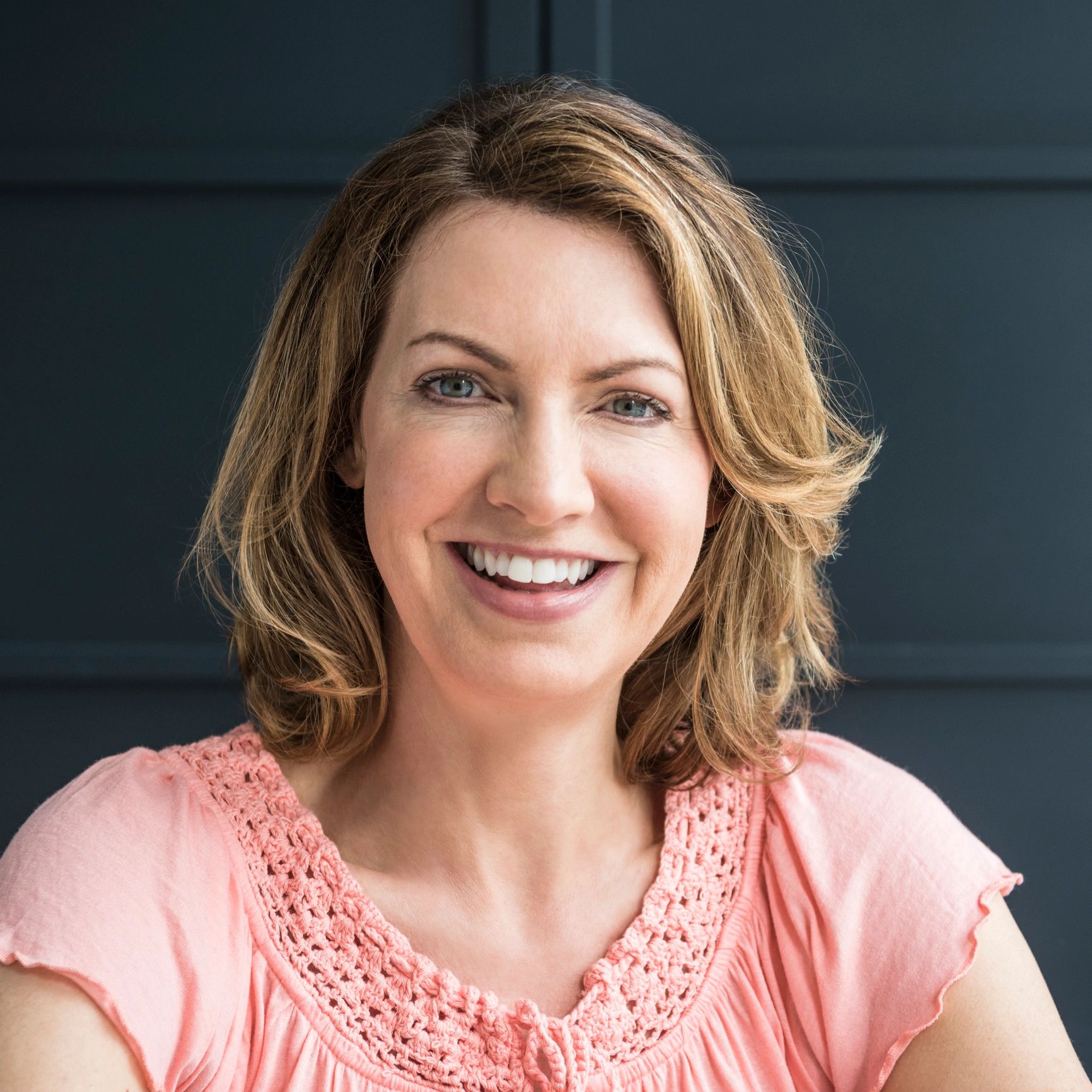 Cheerful mature woman smiling toward camera